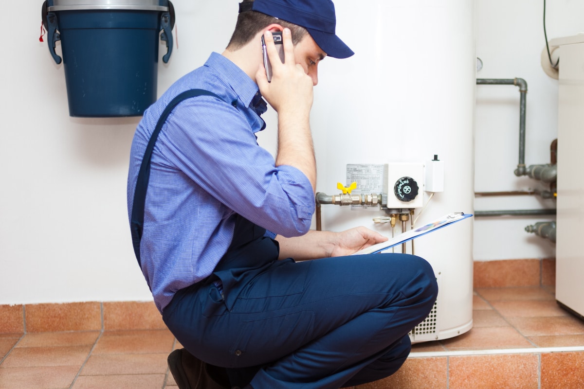 Technician servicing an hot-water heater